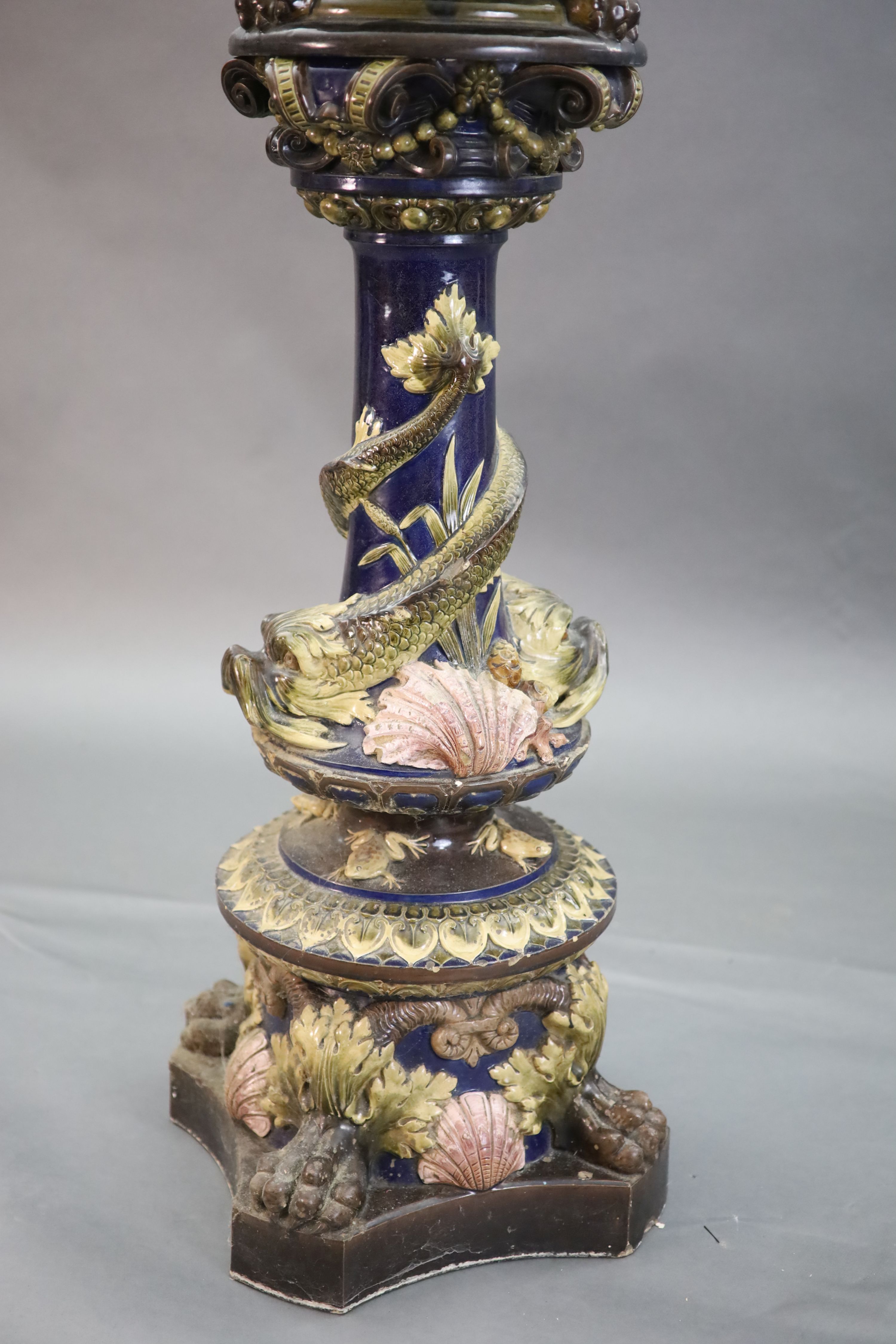 A Continental Palissy style grotesque pottery jardiniere and associated pedestal, late 19th century, total height 134cm